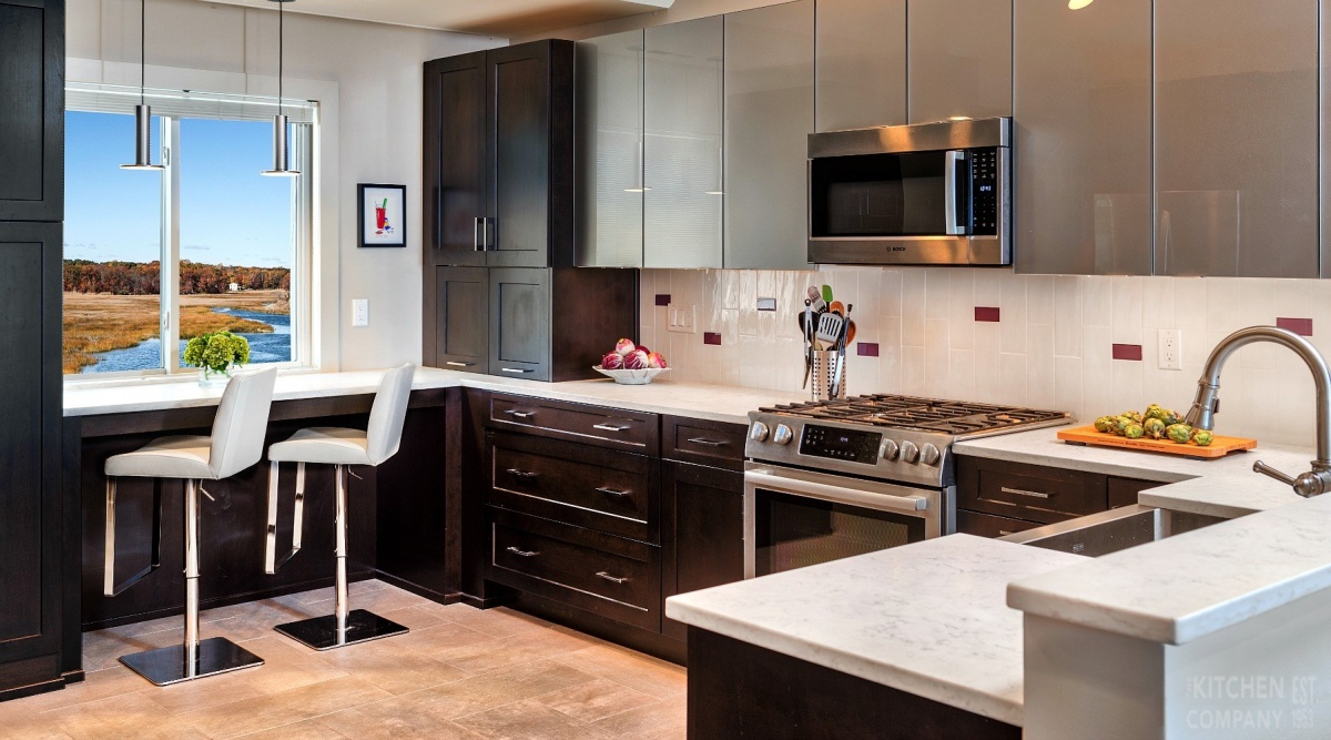 modern kitchen design with back painted glass and dark cherry wood cabinets